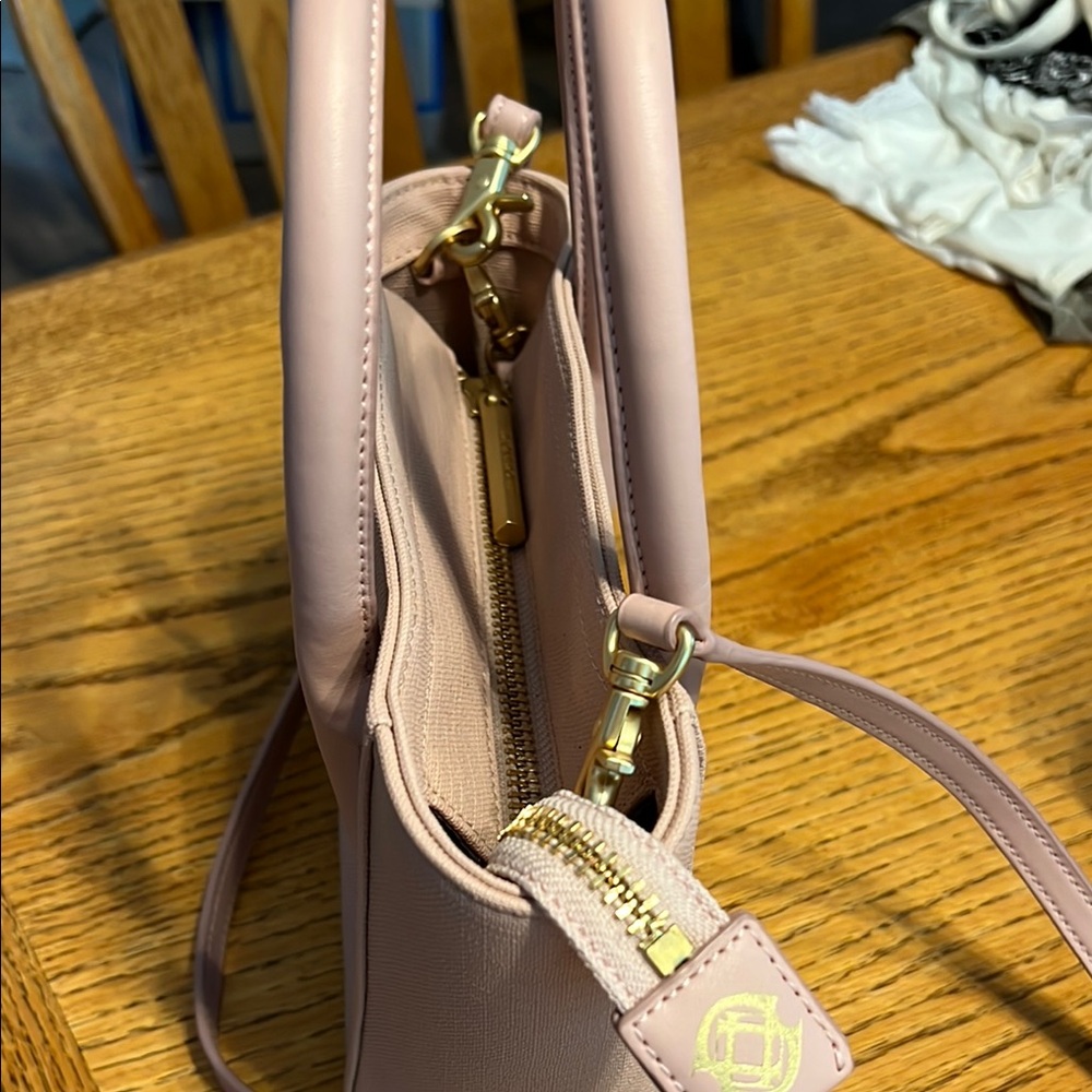 Pink Crossbody Bag with Gold Hardware and Structured Design